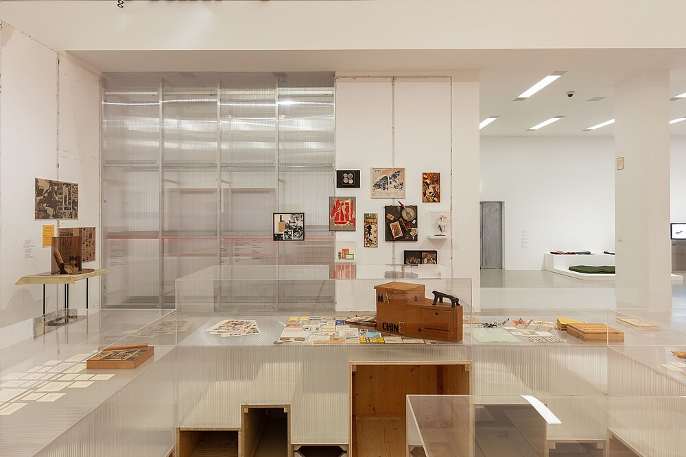  a bright exhibition space with various works of art in different sizes and shapes