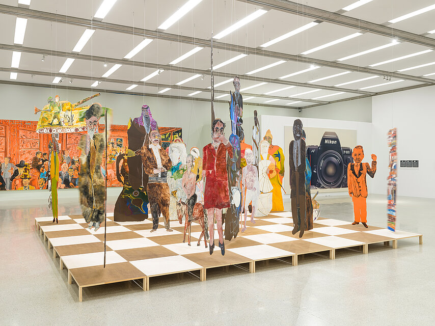  Artistic installation in the form of a chessboard with colourful cardboard figures on it